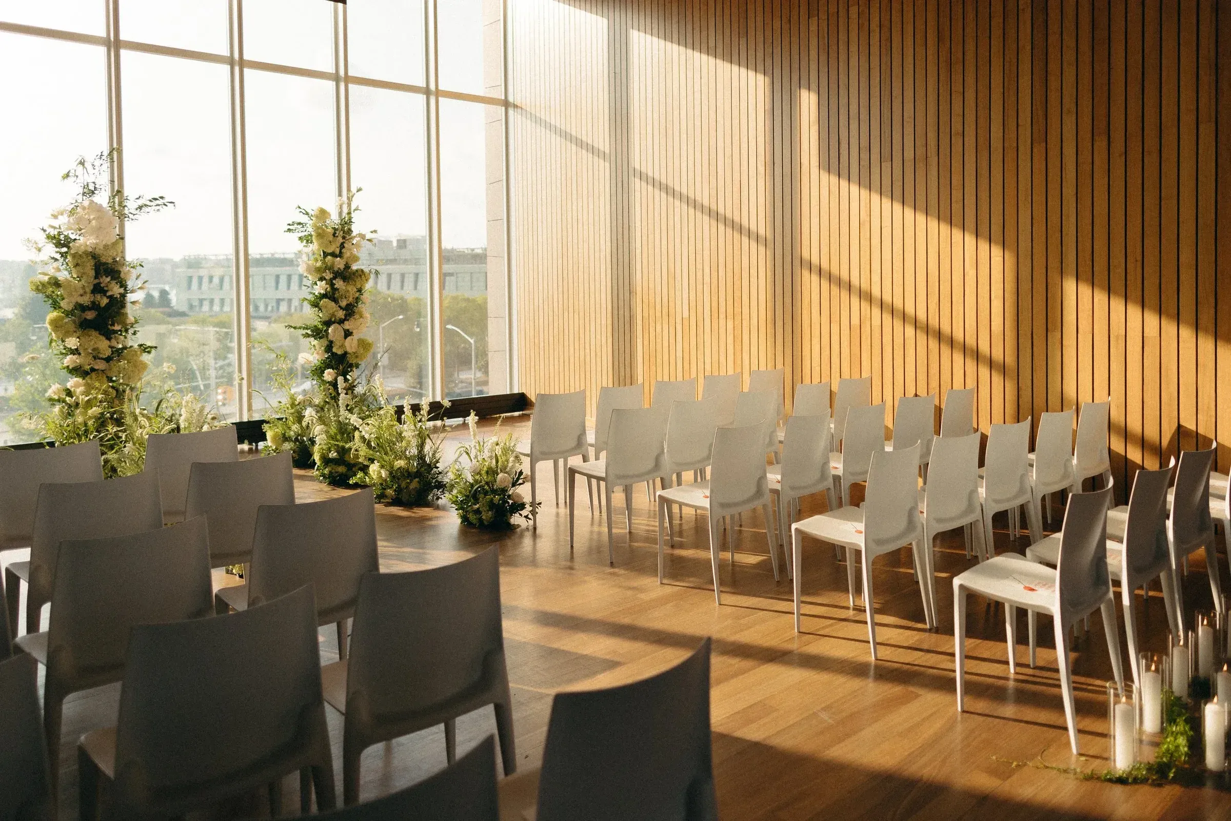 Rows of chairs set by the windows before doors open